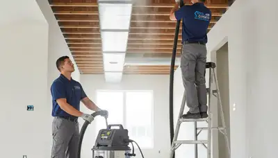 Technician cleaning residential air ducts for HVAC system in Columbus, OH by Five Star Cooling